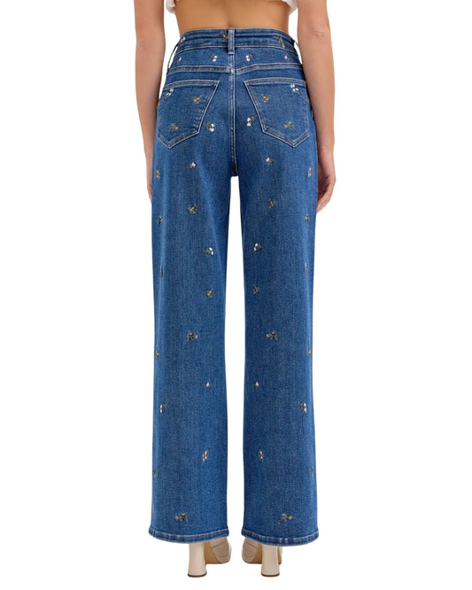 Jeans denim azul con flores bordadas