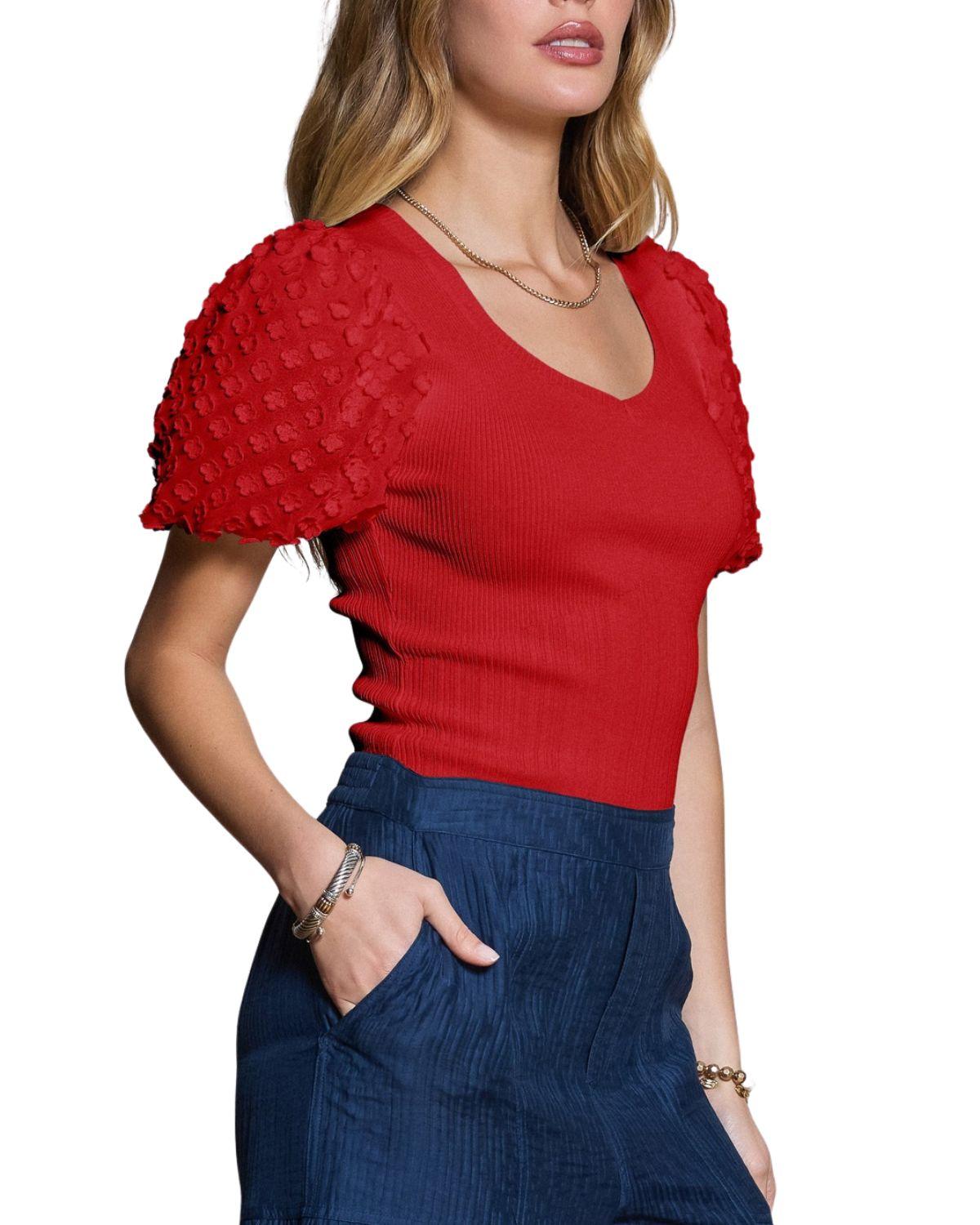 Top de punto femenino con textura floral 3D