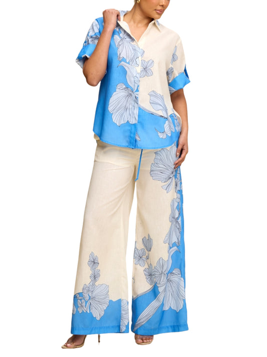 Set de blusa y pantalón con print flores gigantes.