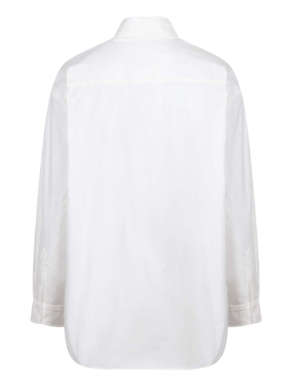 Blusa de manga larga en algodón de ojillos.