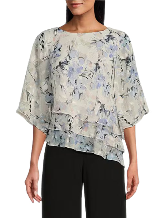 Blusa asimétrica en chifón de manga corta.