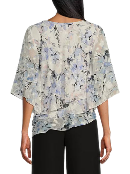 Blusa asimétrica en chifón de manga corta.